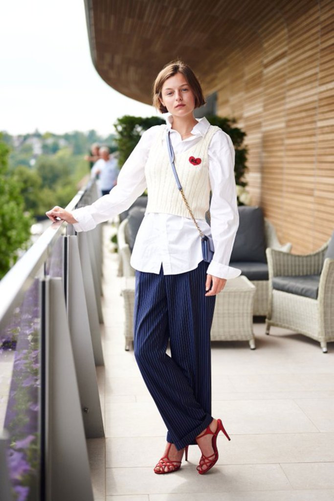 Emma Corrin Wearing Knitted Vest and Tailored Trousers, Courtesy of Ralph Lauren
