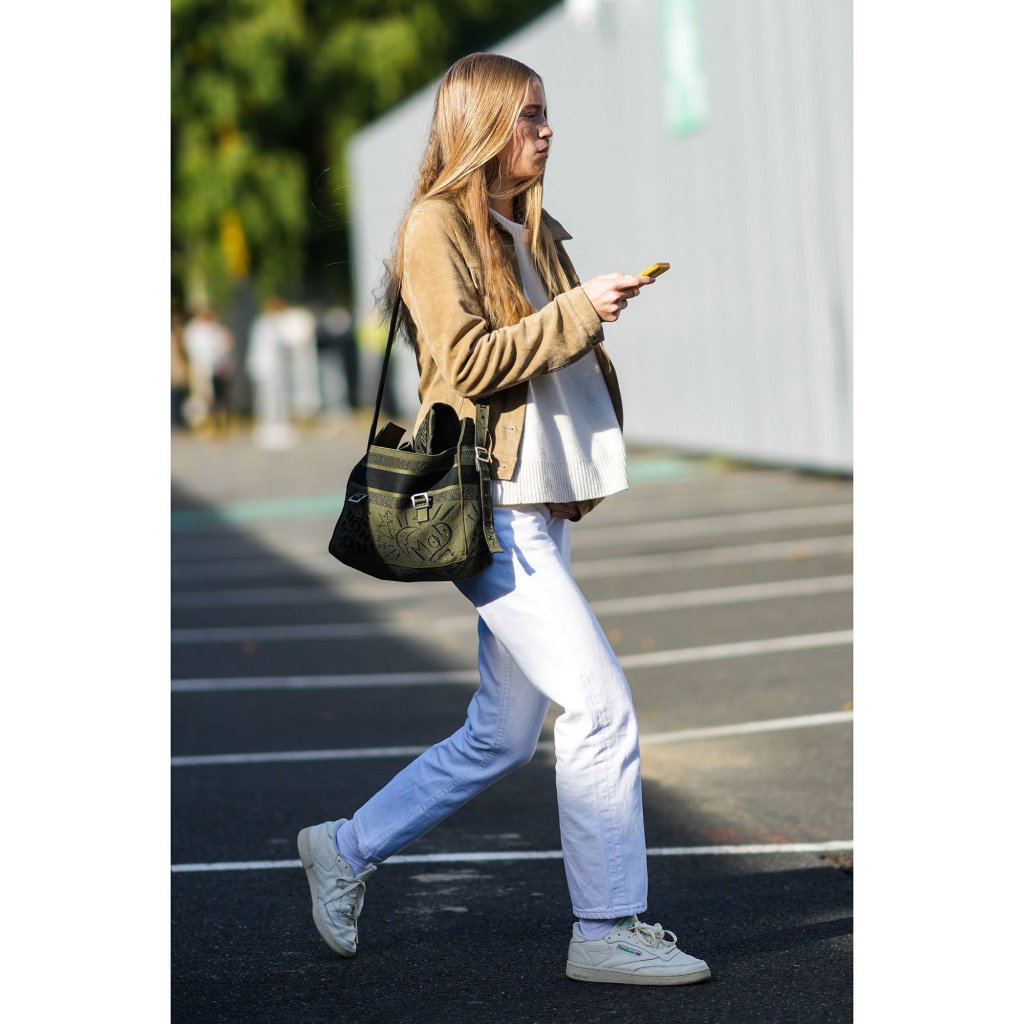 Street Style picture of girl in white Reebok trainers