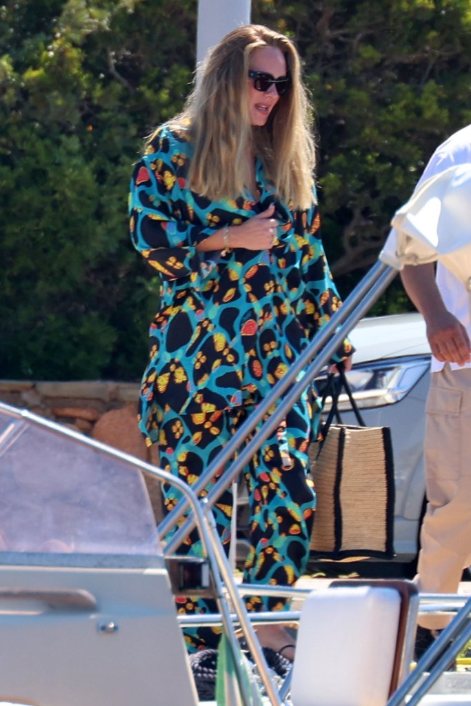 Mandatory Credit: Photo by Ciao Pix/Shutterstock. Adele and Rich Paul are seen boarding a boat in Sardinia, Italy Adele and fiance Rich Paul are seen boarding a boat in Sardinia, Italy - 19 Jul 2022 Wearing Loewe