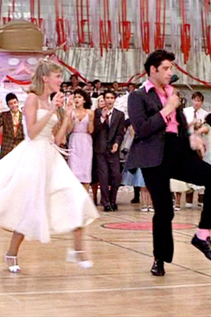 LOS ANGELES - JUNE 16: The movie "Grease", directed by Randal Kleiser. Seen here at high school dance (from left) Olivia Newton-John as Sandy and John Travolta as Danny Zuko.??Initial theatrical release of the film, June 16, 1978.??Screen capture. Paramount Pictures. (Photo by CBS via Getty Images)