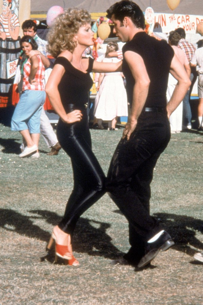 Olivia Newton-John and John Travolta on the set of Grease, directed by Randal Kleiser, 1978. (Photo by Paramount Pictures/Sunset Boulevard/Corbis via Getty Images)